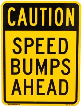 Caution Speed Bumps Ahead Sign