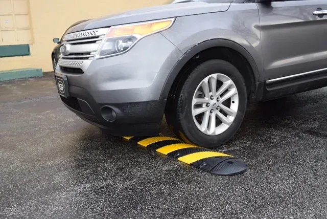 image of yellow and black stripped speed bump